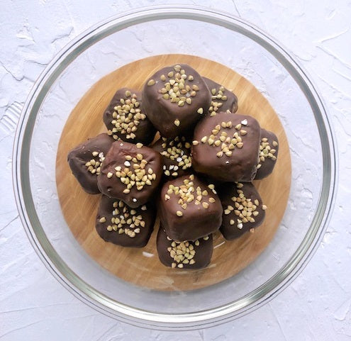Try some new healthy snacks made from Gram's plastic-free ingredients like this Choc-Coated Peanut Butter Cheesecake Bites