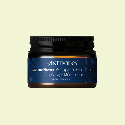 Antipodes Jasmine Flower Menopause Facial Cream jar on a light yellow background