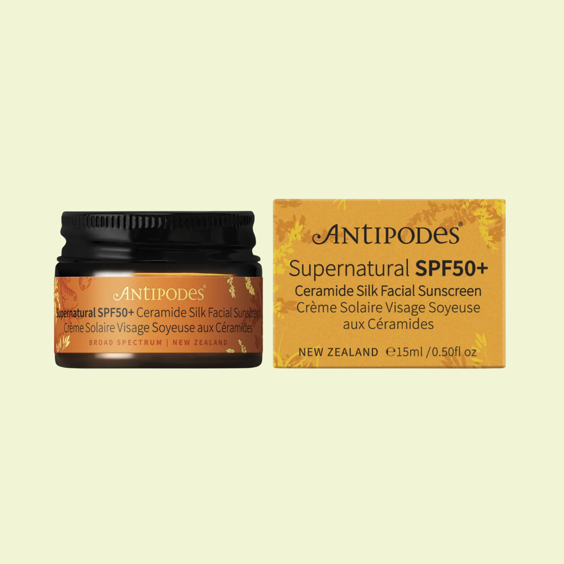 Antipodes Supernatural SPF50+ sunscreen jar and box on a beige background