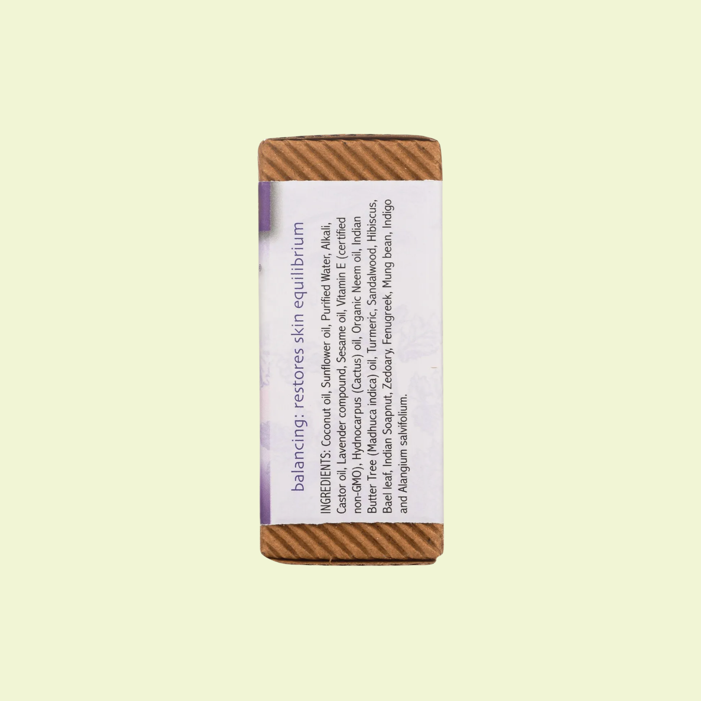 Bar of soap with a wooden handle on a light beige background