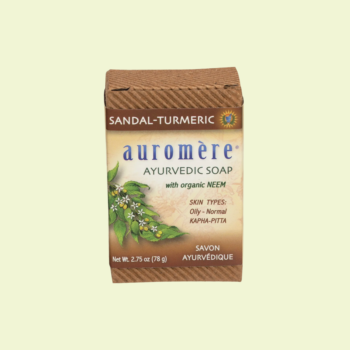 Auromère Sandal-Turmeric Ayurvedic Soap packaging on a beige background