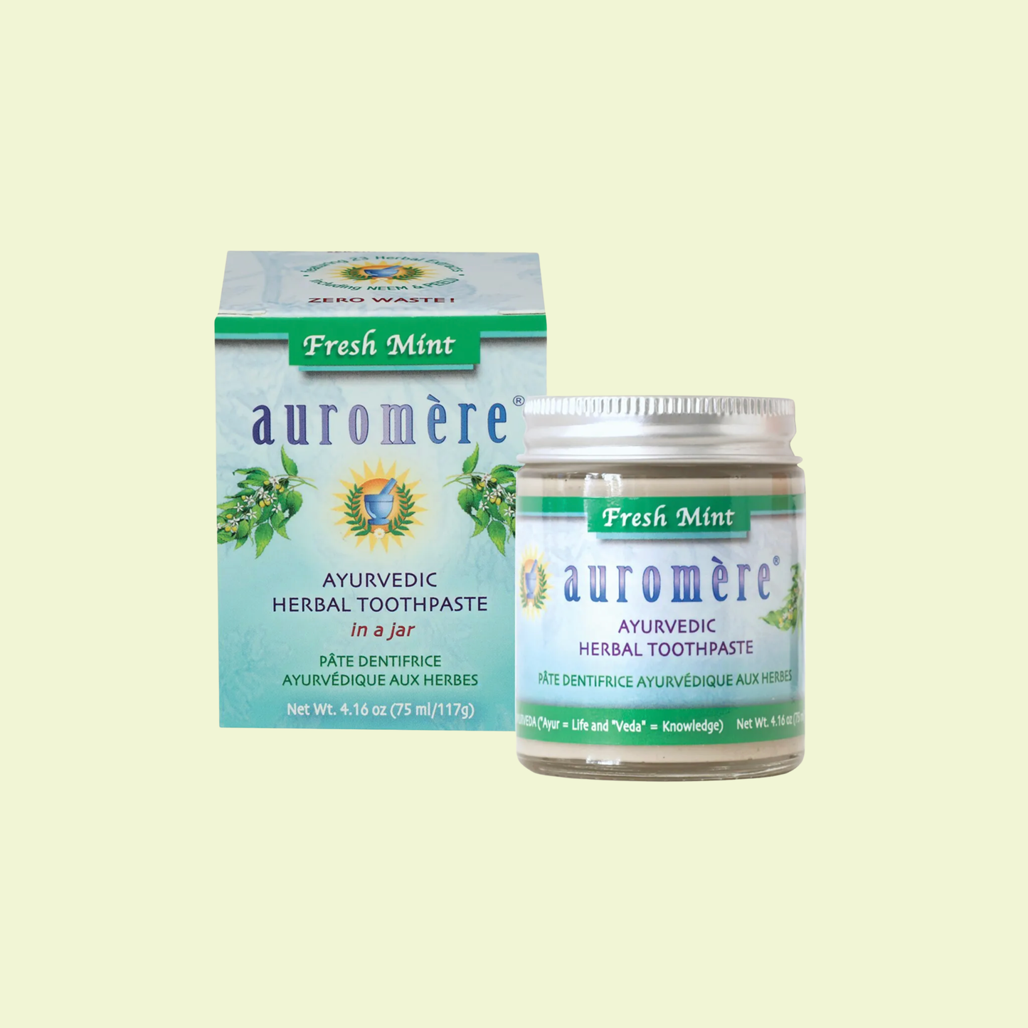 Auromère Ayurvedic Herbal Toothpaste packaging on a light yellow background