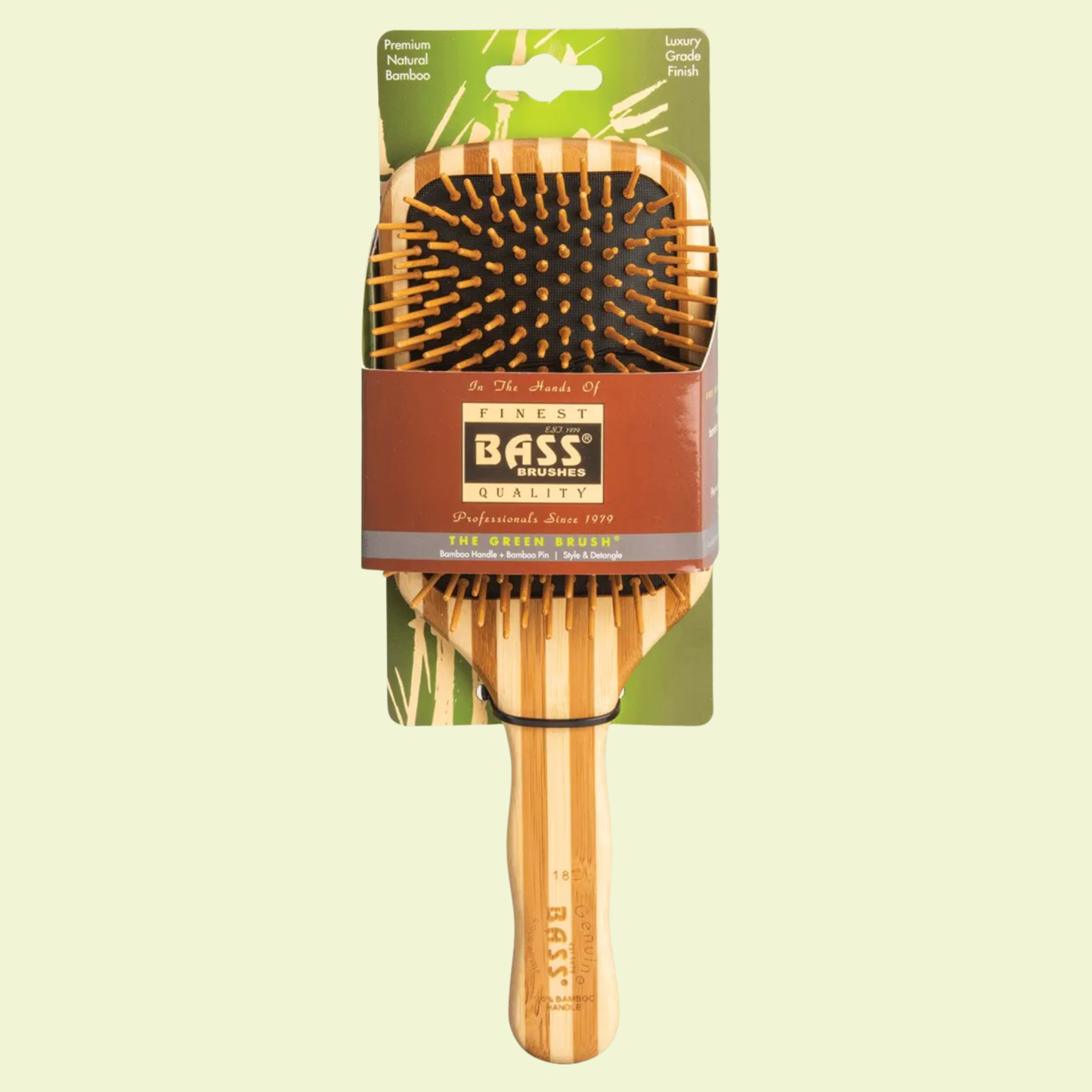 Bass Brushes hairbrush with packaging on a light green background