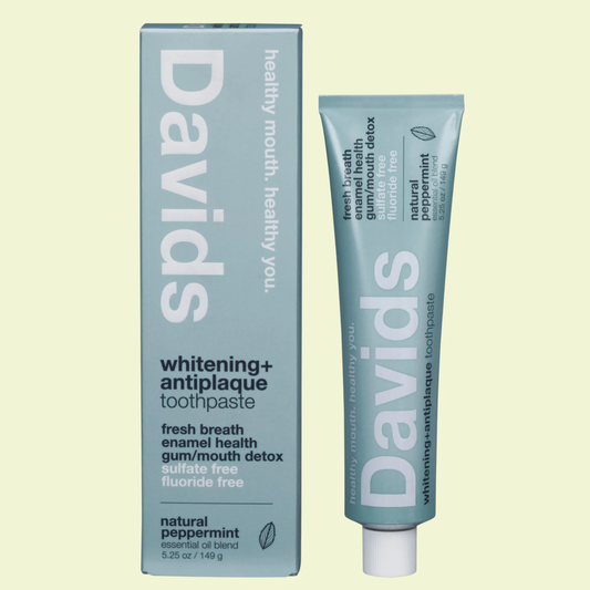 Davids whitening and antiplaque toothpaste packaging on a light green background