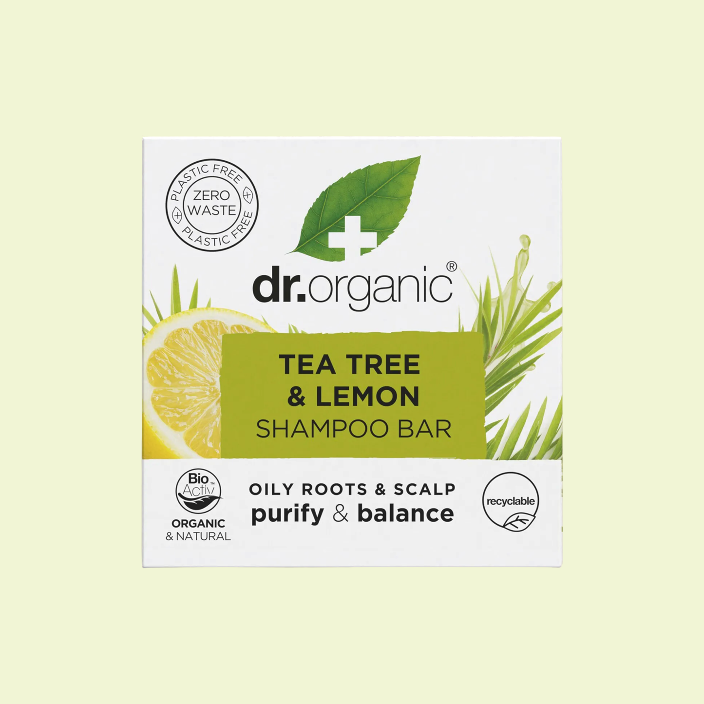Dr. Organic Tea Tree & Lemon Shampoo Bar packaging on a light yellow background