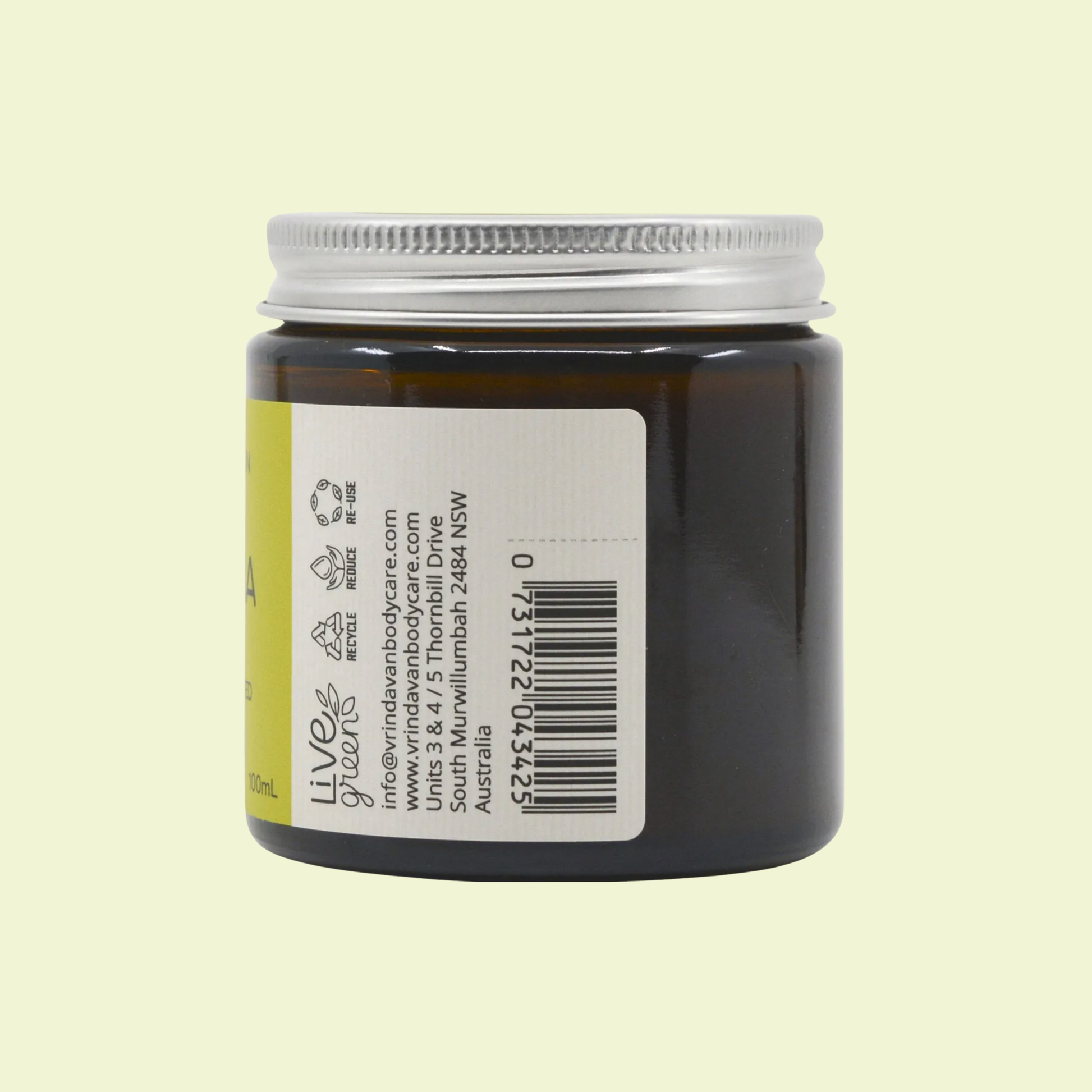 Jar of Vrinda Body Care product with label and barcode on a light green background