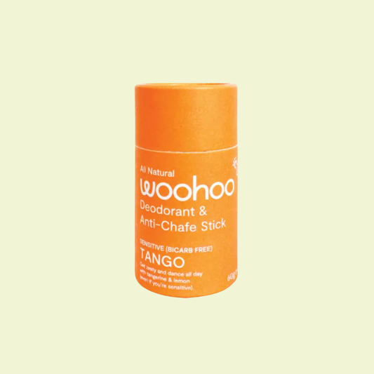 Orange deodorant stick with 'woohoo' branding on a light yellow background